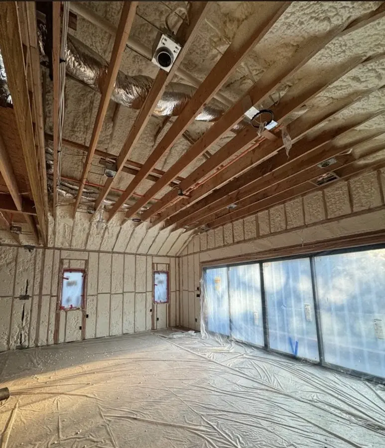 Interior walls and ceiling insulated with spray foam during new construction in Elgin