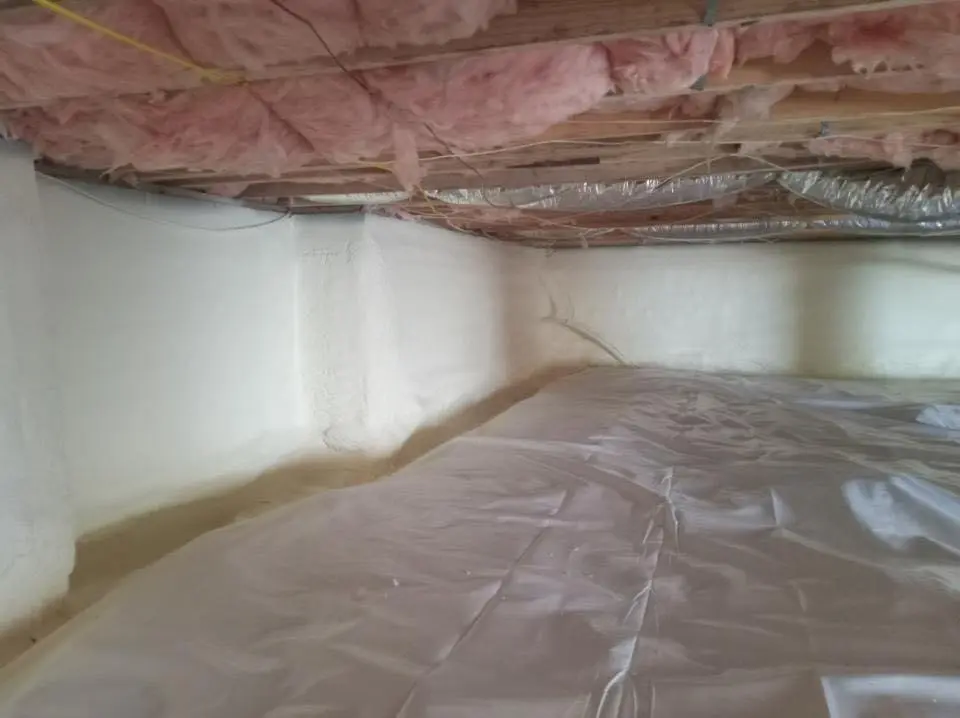 Crawl space encapsulation with closed-cell spray foam for Commercial Roof Restoration in Elgin